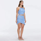 Arlo Baby Blue Fringe Detail Asymmetric Mini Skirt | Moeva | RTW Skirts | Each week unveils new pieces—luxury swimwear, fluid resort silhouettes, and elevated summer-to-evening essentials designed to carry you from coastal escapes to city nights.