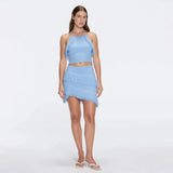 Nebula And Arlo Fringe Asymmetric Blue Knit Set | Moeva | | Each week unveils new pieces—luxury swimwear, fluid resort silhouettes, and elevated summer-to-evening essentials designed to carry you from coastal escapes to city nights.
