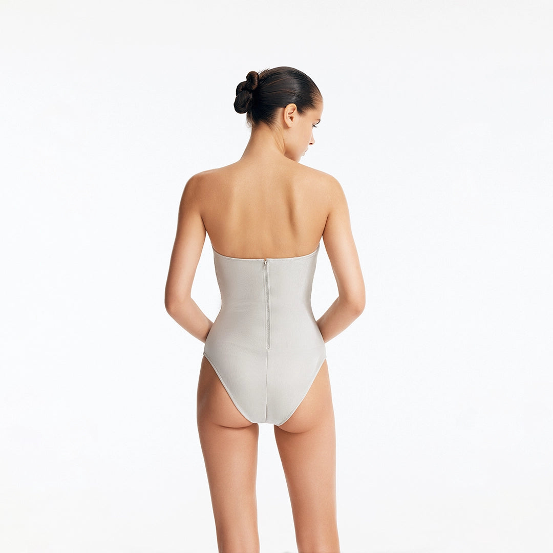 Rhodes Silver Bandeau Cut-Out Swimsuit by Moeva | Swimsuit from MOEVA's luxury swimwear and resortwear collection, perfect for beach days, resort escapes and summer styling.