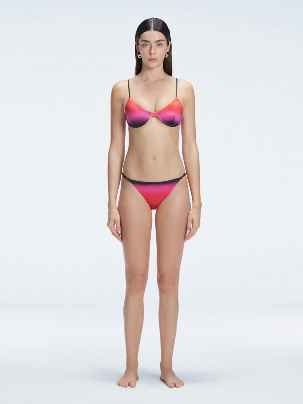 Front view of model wearing Rory Pİnk Optical Bikini Top with halterneck design and underwire support.