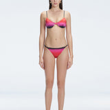 Front view of model wearing Rory Pİnk Optical Bikini Top with halterneck design and underwire support.