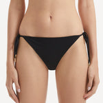 Sarita Black Side Tie Bikini Bottom | Moeva | Bikini Bottom | Each week unveils new pieces—luxury swimwear, fluid resort silhouettes, and elevated summer-to-evening essentials designed to carry you from coastal escapes to city nights.