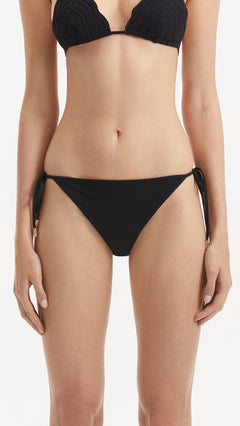 Sarita Black Side Tie Bikini Bottom | Moeva | Bikini Bottom | Each week unveils new pieces—luxury swimwear, fluid resort silhouettes, and elevated summer-to-evening essentials designed to carry you from coastal escapes to city nights.