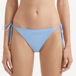 Sarita Baby Blue Side Tie Bikini Bottom | Moeva | Bikini Bottom | Each week unveils new pieces—luxury swimwear, fluid resort silhouettes, and elevated summer-to-evening essentials designed to carry you from coastal escapes to city nights.