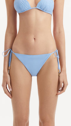 Sarita Baby Blue Side Tie Bikini Bottom | Moeva | Bikini Bottom | Each week unveils new pieces—luxury swimwear, fluid resort silhouettes, and elevated summer-to-evening essentials designed to carry you from coastal escapes to city nights.