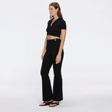 Shandy Black Polo Collar Knitted Crop Top | Moeva | RTW Bustiers | Each week unveils new pieces—luxury swimwear, fluid resort silhouettes, and elevated summer-to-evening essentials designed to carry you from coastal escapes to city nights.