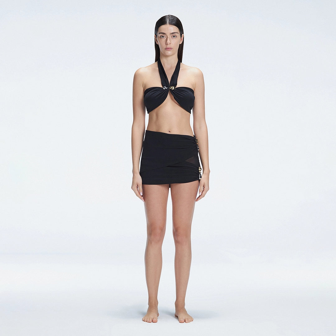 Siena Black Mesh Detail Mini Skirt | Moeva | Beachwear Skirts | Each week unveils new pieces—luxury swimwear, fluid resort silhouettes, and elevated summer-to-evening essentials designed to carry you from coastal escapes to city nights.