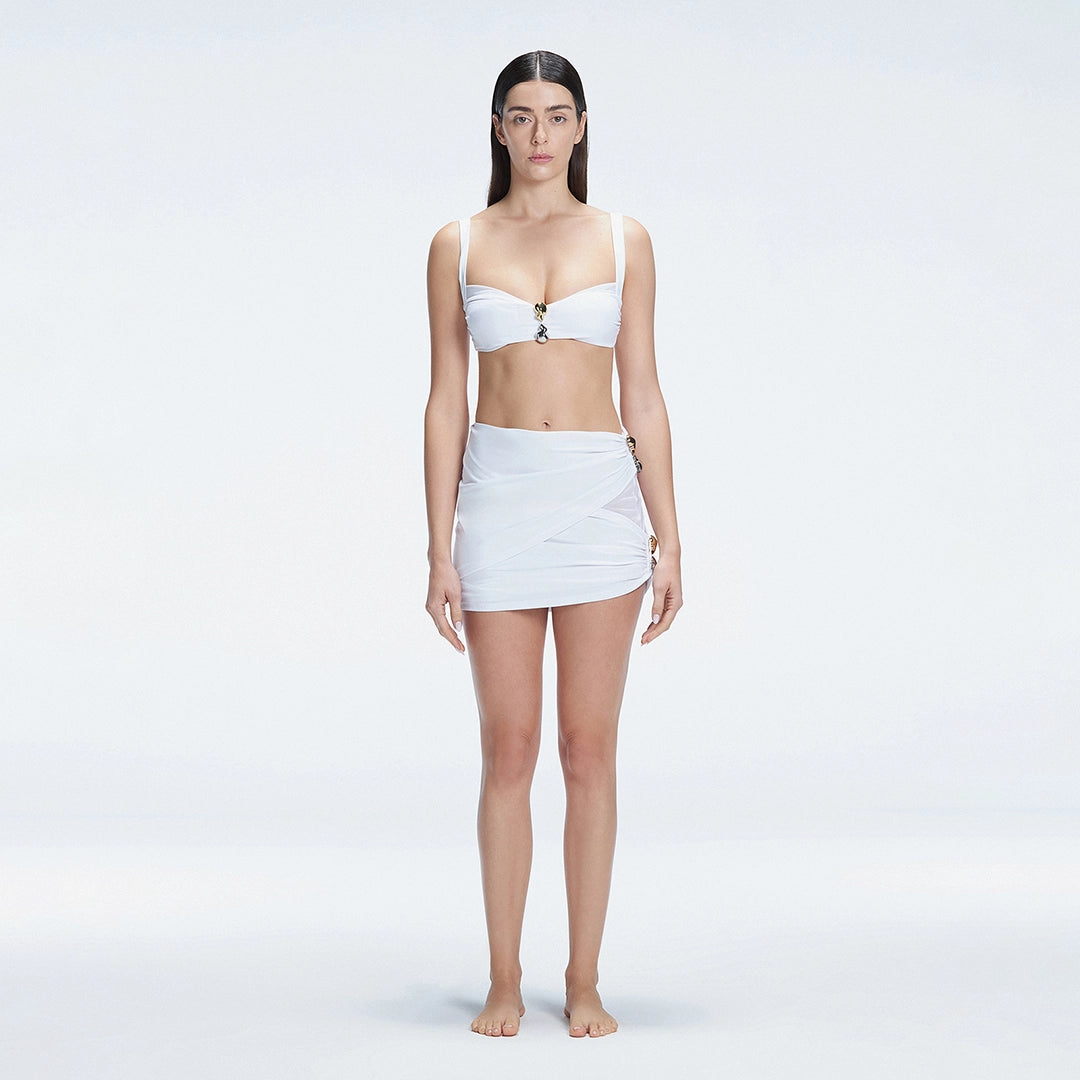 Siena White Mesh Detail Mini Skirt | Moeva | Beachwear Skirts | Each week unveils new pieces—luxury swimwear, fluid resort silhouettes, and elevated summer-to-evening essentials designed to carry you from coastal escapes to city nights.