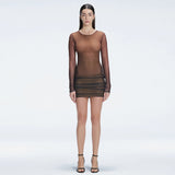 Sylvie Black Optical Long Sleeve Mini Dress | Moeva | Dress | Each week unveils new pieces—luxury swimwear, fluid resort silhouettes, and elevated summer-to-evening essentials designed to carry you from coastal escapes to city nights.