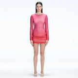 Sylvie Pink Optical Long Sleeve Mini Dress | Moeva | Dress | Each week unveils new pieces—luxury swimwear, fluid resort silhouettes, and elevated summer-to-evening essentials designed to carry you from coastal escapes to city nights.