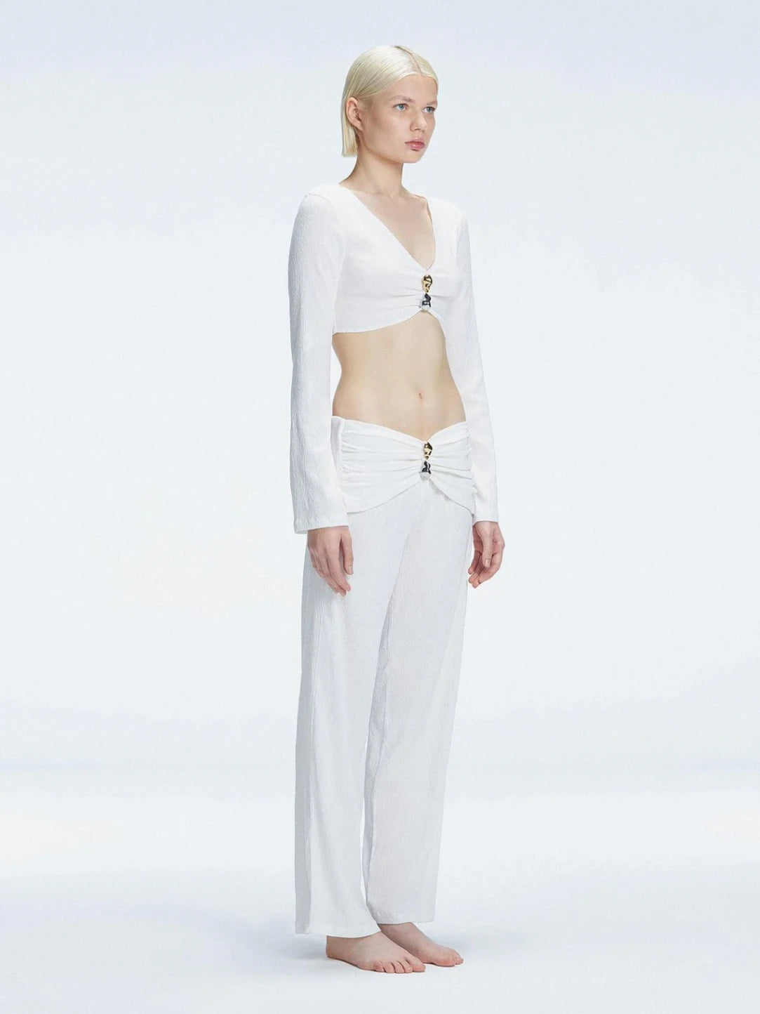 Sirenia Long Sleeve Crop Top and Helena Straight Leg Accessorised Pants White Set | Moeva | Shirt and Pants | Each week unveils new pieces—luxury swimwear, fluid resort silhouettes, and elevated summer-to-evening essentials designed to carry you from coastal escapes to city nights.