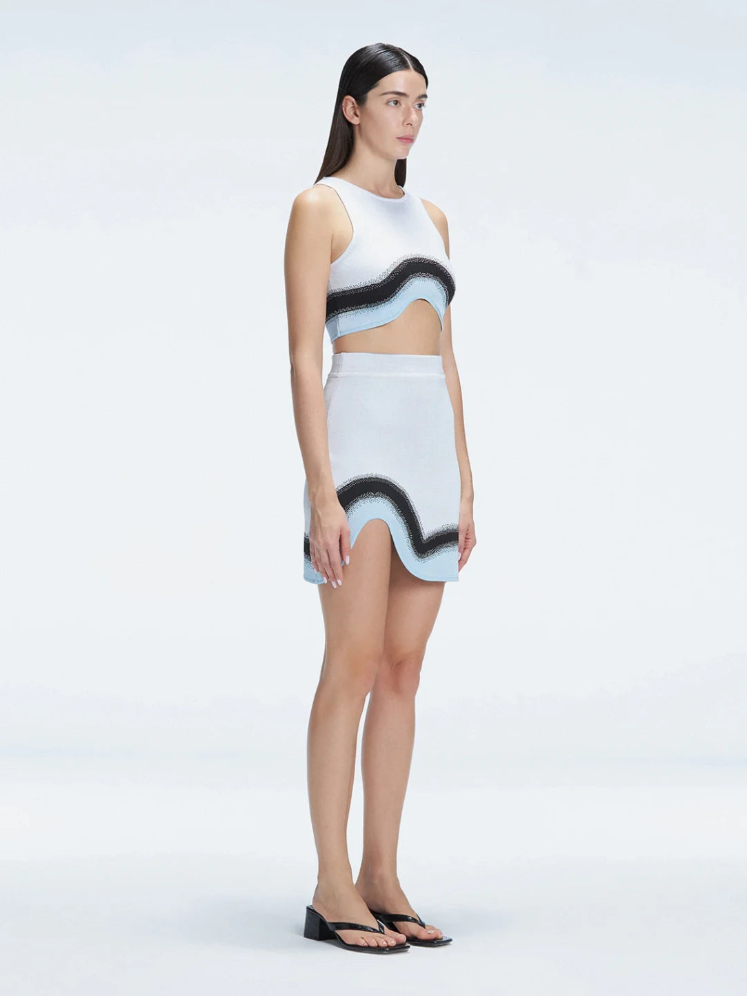 Lydia White Optical Knit Mini Skirt | Moeva | Skirt | Each week unveils new pieces—luxury swimwear, fluid resort silhouettes, and elevated summer-to-evening essentials designed to carry you from coastal escapes to city nights.