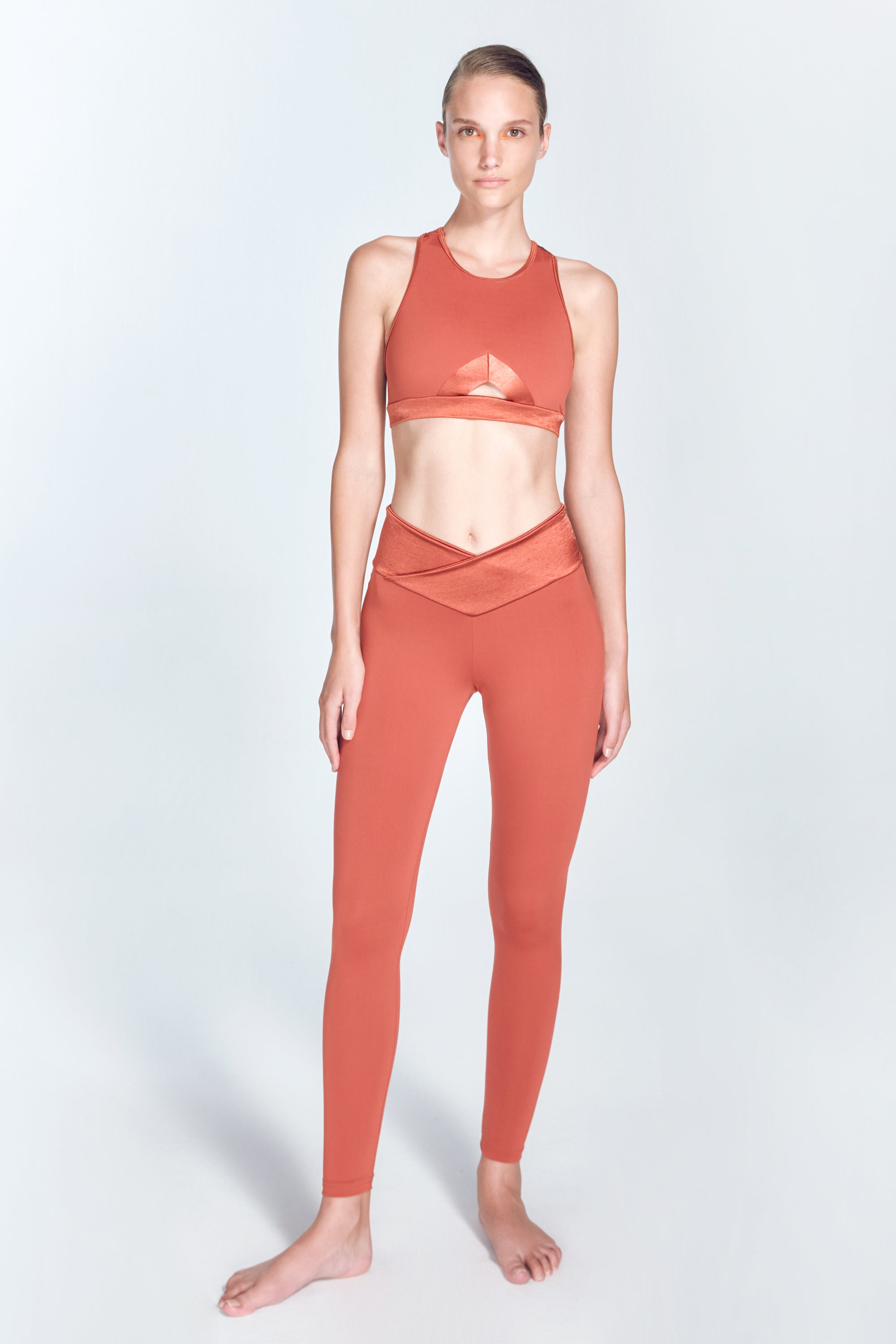 Melina Red Ochre Leggings | Moeva | Activewear | Each week unveils new pieces—luxury swimwear, fluid resort silhouettes, and elevated summer-to-evening essentials designed to carry you from coastal escapes to city nights.