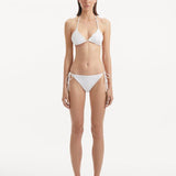 Sarita White Side Tie Bikini Bottom | Moeva | Bikini Bottom | Each week unveils new pieces—luxury swimwear, fluid resort silhouettes, and elevated summer-to-evening essentials designed to carry you from coastal escapes to city nights.
