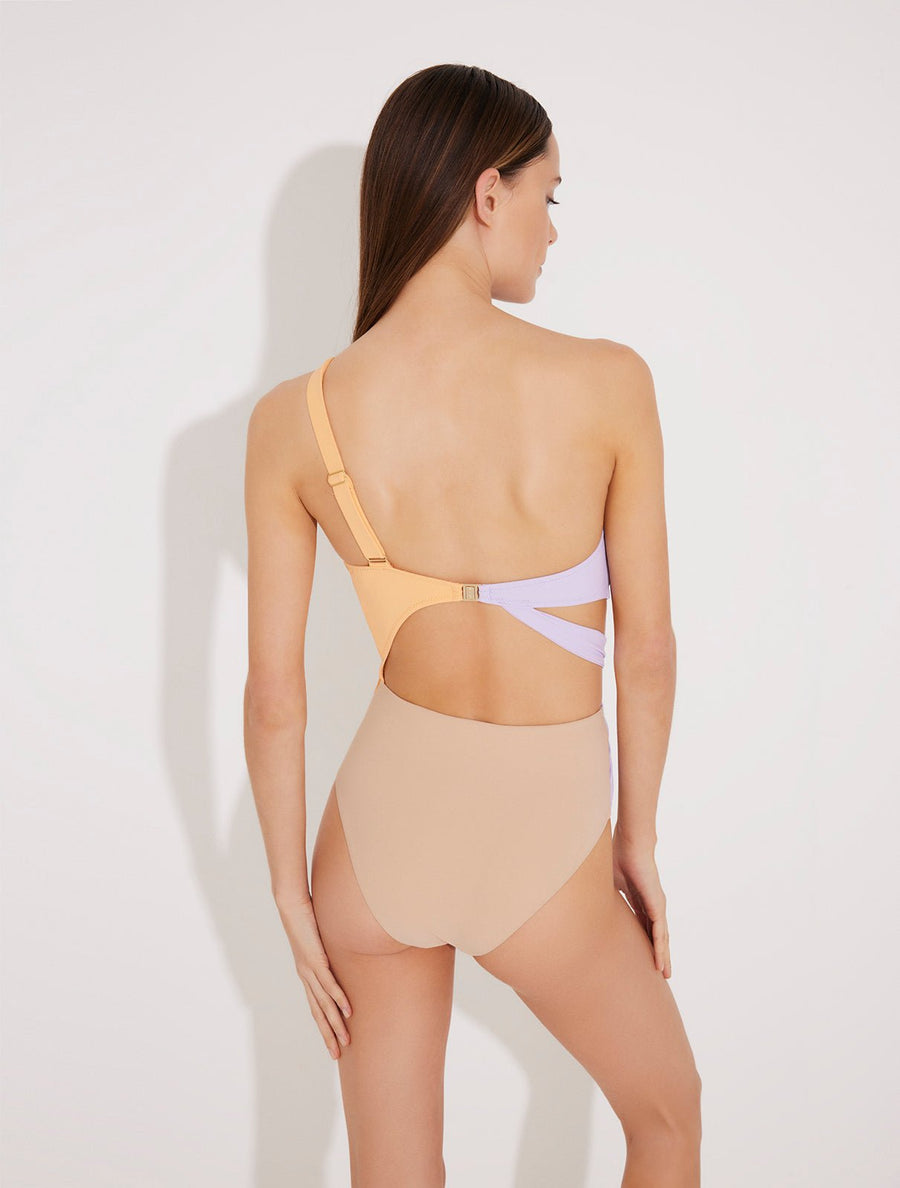 Back View: Model in Adelina Orange/Lilac/Nude Swimsuit - MOEVA Luxury Swimwear, Asymmetric Cutouts Accented With Drapes, One Shoulder, Gold Clasps at the Back, Rectangular Accessories, Moderate Bottom Coverage, One Piece Swimsuit, MOEVA Luxury Swimwear 