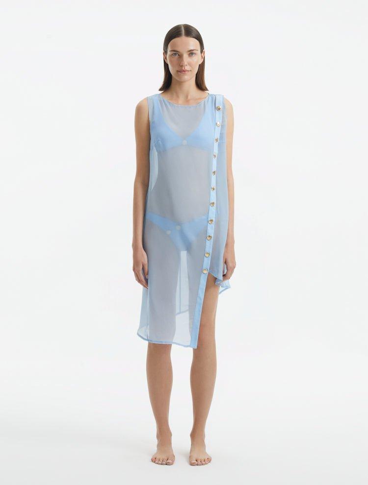 Adora Baby Blue Sheer Sleeveless Asymmetric Dress with Gold Button Detail | Moeva | Dress | Each week unveils new pieces—luxury swimwear, fluid resort silhouettes, and elevated summer-to-evening essentials designed to carry you from coastal escapes to city nights.