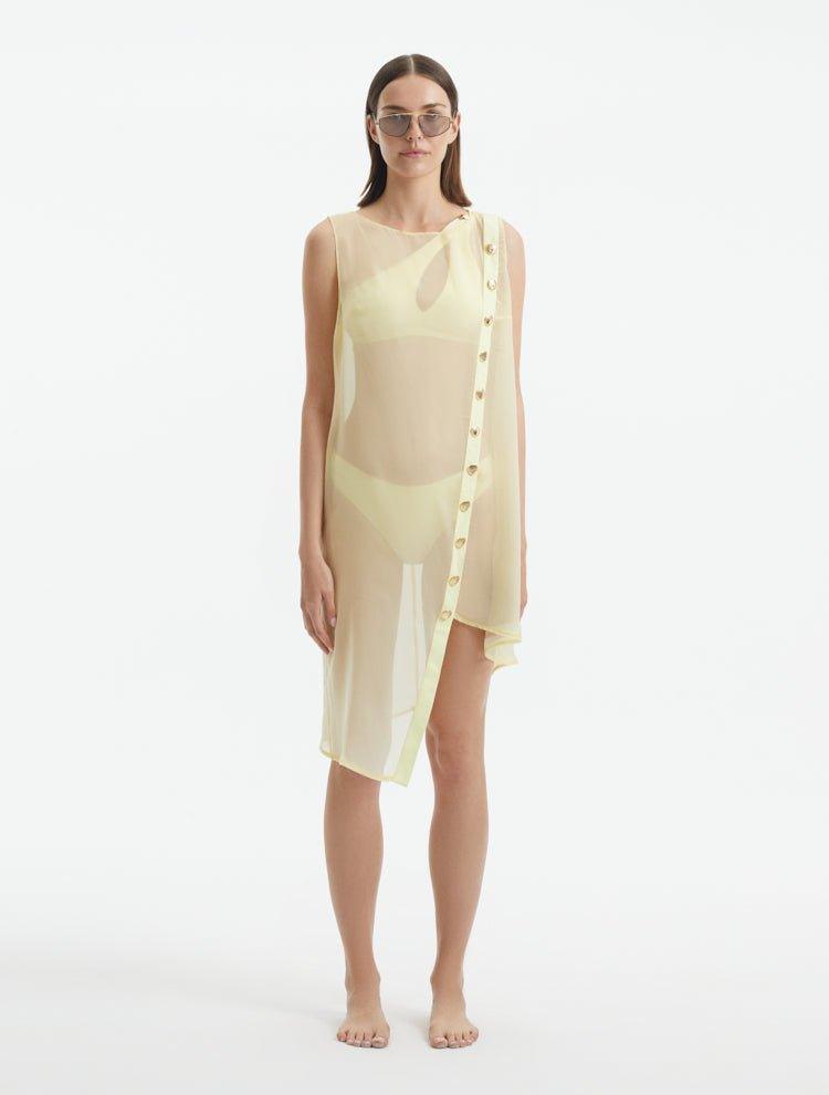 Adora Yellow Sheer Sleeveless Asymmetric Dress with Gold Button Detail | Moeva | Dress | Each week unveils new pieces—luxury swimwear, fluid resort silhouettes, and elevated summer-to-evening essentials designed to carry you from coastal escapes to city nights.