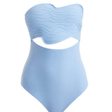 Close-up of Adria Blue Swimsuit focusing on the cut-out details along the sides. The wavy texture and premium Italian fabric are featured, showcasing the swimsuit's blend of elegance and athletic functionality.