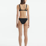 Aeron Black V Neck Textured Bikini Top | Moeva | Bikini Top | Each week unveils new pieces—luxury swimwear, fluid resort silhouettes, and elevated summer-to-evening essentials designed to carry you from coastal escapes to city nights.