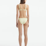 Aeron Yellow V Neck Textured Bikini Top | Moeva | Bikini Top | Each week unveils new pieces—luxury swimwear, fluid resort silhouettes, and elevated summer-to-evening essentials designed to carry you from coastal escapes to city nights.