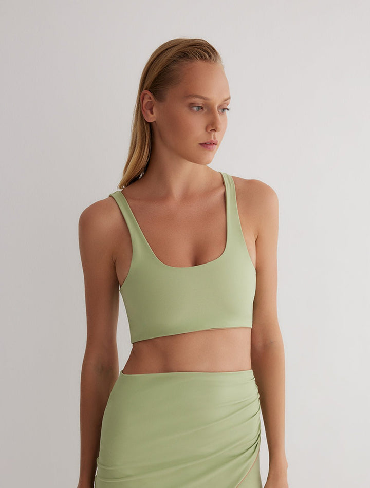 Front View: Model in Alva Green/Nude Reversible Top - MOEVA Luxury Swimwear, Ready to Wear	Top, Fully Lined, Comfort and Sportive, Reversible Stretchy Fabric, MOEVA Luxury Swimwear