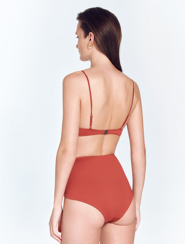 Back View: Model in Beatrice Red Ochre Bikini Top - MOEVA Luxury Swimwear, Gold Clasps at the Back, Lycra XtraLife® Certificate, Italian Fabric, MOEVA Luxury Swimwear