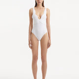 Natalie Lim Suarez - Breena White V Neck Swimsuit | Moeva | Swimsuit | Each week unveils new pieces—luxury swimwear, fluid resort silhouettes, and elevated summer-to-evening essentials designed to carry you from coastal escapes to city nights.