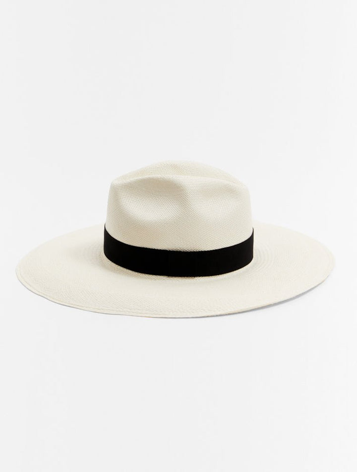 Front View: Brett White Hat With Black Trim - MOEVA Luxury Swimwear, Straw Hat, Handwoven in Ecuador, Lightweight Straw, Single Crease, High Crown, Short Brim, Grosgrain Trim, Moeva Logo Plaque, 100% Toquilla Straw, MOEVA Luxury Swimwear 