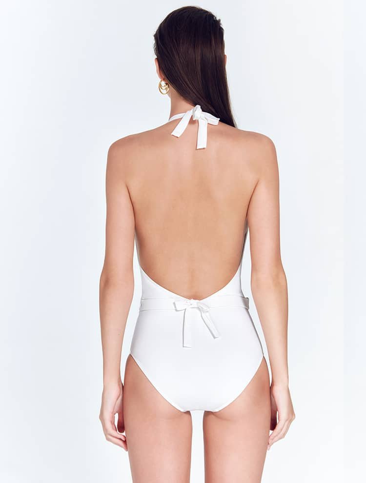 Back View: Model in Bridget White Swimsuit - Thicker Fabric with Lycra® to Prevent See-Through When Wet, Lined, Halter Neck One Piece Swimsuit, MOEVA Luxury Swimwear 