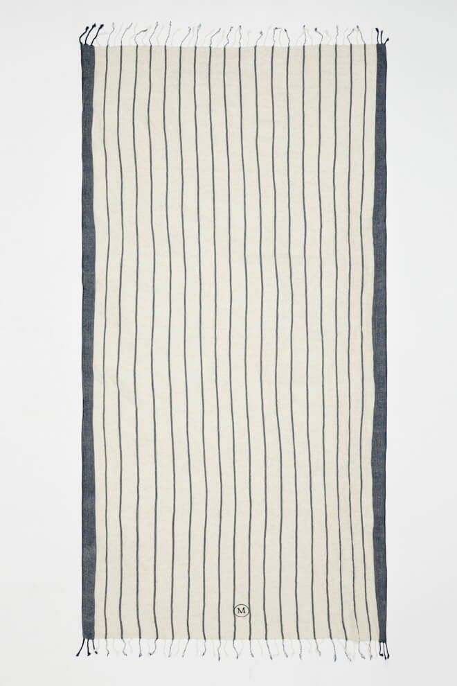 Capri Dark Blue/Beige Towel | Moeva | Towel | Each week unveils new pieces—luxury swimwear, fluid resort silhouettes, and elevated summer-to-evening essentials designed to carry you from coastal escapes to city nights.
