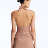 Clementine Bronze Halterneck Swimsuit with Tie-Front Skirt Detail | Moeva | Swimsuit | Each week unveils new pieces—luxury swimwear, fluid resort silhouettes, and elevated summer-to-evening essentials designed to carry you from coastal escapes to city nights.