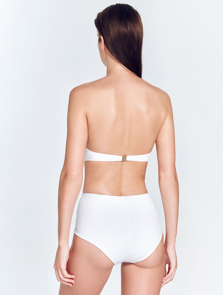 Back View: Model in Dylan White Bikini Bottom - MOEVA Luxury Swimwear, Comfort and Chic, Soft Touch Italian Fabric, Special Lycra Xtralife® Certificate, MOEVA Luxury Swimwear