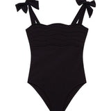Everlee Black Kids Swimsuit with Bow Strap Detail | Moeva | Kids Swimsuits | Each week unveils new pieces—luxury swimwear, fluid resort silhouettes, and elevated summer-to-evening essentials designed to carry you from coastal escapes to city nights.