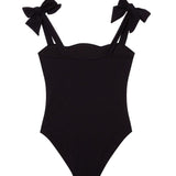 Everlee Black Kids Swimsuit with Bow Strap Detail | Moeva | Kids Swimsuits | Each week unveils new pieces—luxury swimwear, fluid resort silhouettes, and elevated summer-to-evening essentials designed to carry you from coastal escapes to city nights.