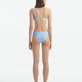 Eyre Baby Blue Mid Coverage Textured Bikini Bottom | Moeva | Bikini Bottom | Each week unveils new pieces—luxury swimwear, fluid resort silhouettes, and elevated summer-to-evening essentials designed to carry you from coastal escapes to city nights.