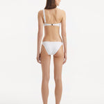 Harbor White One Shoulder Solid Bikini Top | Moeva | Bikini Top | Each week unveils new pieces—luxury swimwear, fluid resort silhouettes, and elevated summer-to-evening essentials designed to carry you from coastal escapes to city nights.