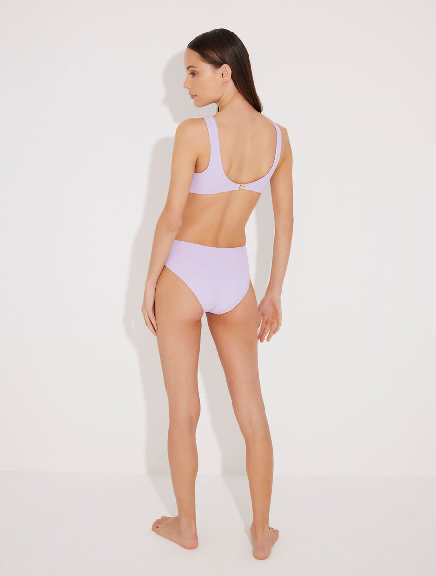 Back View: Model in Honora Lilac Swimsuit - MOEVA Luxury Swimwear, Low Back, Gold Clasps at the Back, Full Bottom Coverage, Fully Lined, MOEVA Luxury Swimwear