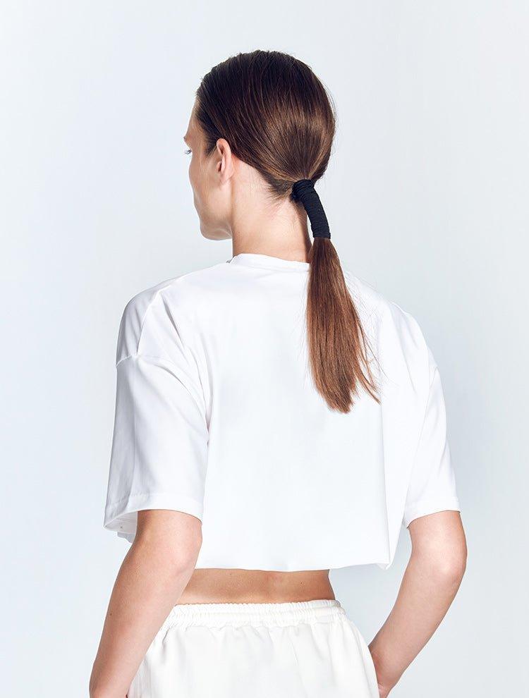 Isolde White Top | Moeva | Activewear | Each week unveils new pieces—luxury swimwear, fluid resort silhouettes, and elevated summer-to-evening essentials designed to carry you from coastal escapes to city nights.