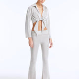 Izara Silver Mid-Rise Flared Pants | Moeva | Women Beachwear Pants | Each week unveils new pieces—luxury swimwear, fluid resort silhouettes, and elevated summer-to-evening essentials designed to carry you from coastal escapes to city nights.