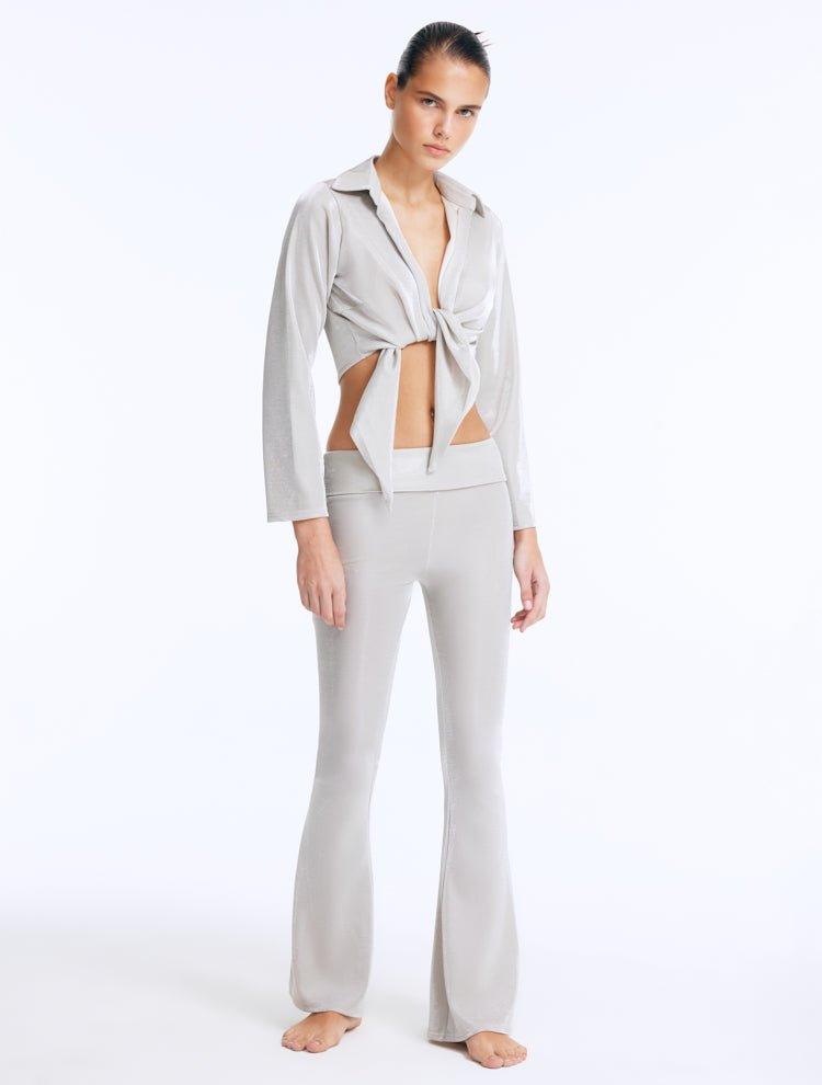 Izara Silver Mid-Rise Flared Pants | Moeva | Women Beachwear Pants | Each week unveils new pieces—luxury swimwear, fluid resort silhouettes, and elevated summer-to-evening essentials designed to carry you from coastal escapes to city nights.