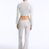 Izara Silver Mid-Rise Flared Pants | Moeva | Women Beachwear Pants | Each week unveils new pieces—luxury swimwear, fluid resort silhouettes, and elevated summer-to-evening essentials designed to carry you from coastal escapes to city nights.