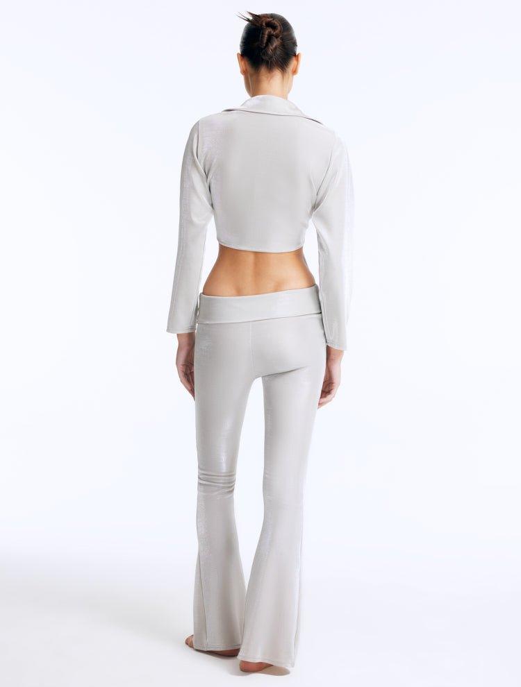 Izara Silver Mid-Rise Flared Pants | Moeva | Women Beachwear Pants | Each week unveils new pieces—luxury swimwear, fluid resort silhouettes, and elevated summer-to-evening essentials designed to carry you from coastal escapes to city nights.