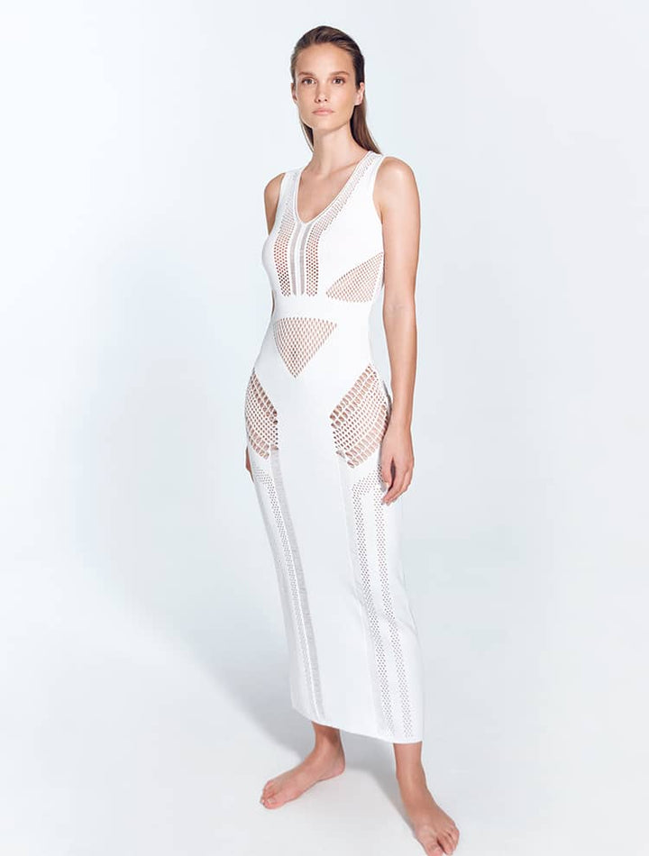 Front View: Model in Izzy White Dress - MOEVA Luxury Swimwear, Knitted Dress, V Neckline, Ankle Length, MOEVA Luxury Swimwear