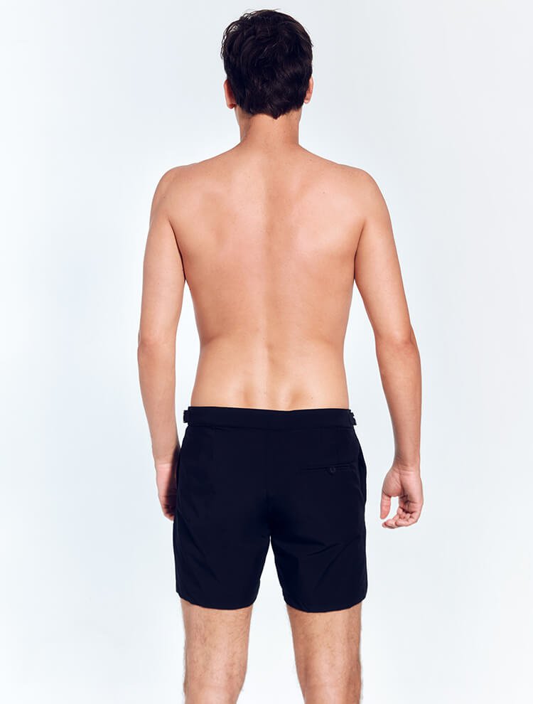 Back View: Model in Jack Black Shorts - MOEVA Luxury Swimwear, Nikel, Mid Length Swim Shorts, Fully Lined, Slim Fit, Strech Classic,  Buttoned Back Pockets, MOEVA Luxury Swimwear