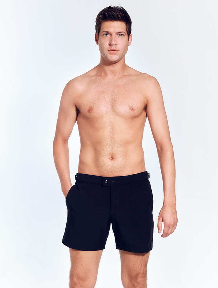 Front View: Model in Jack Black Shorts - MOEVA Luxury Swimwear, Slim Fitting, Lightweight Fabric with Quick Drying, Front Slash Pockets, Snap and Zip Fastening, Buckles at the Waist, Quick Dry, MOEVA Luxury Swimwear