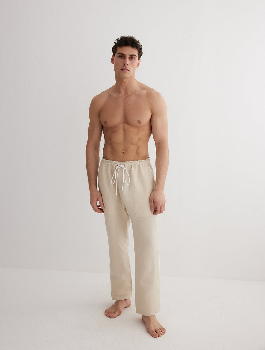 Front View: Model in Joseph Nude Pants - MOEVA Luxury Swimwear, Relaxed Fit, Muslin Fabric, MOEVA Luxury Swimwear