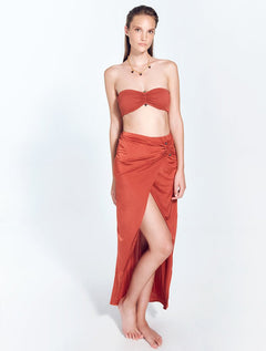Front View: Model in Kalea Red Ochre Skirt - Wrapped Skirt, Slip at Front, Maxi Skirt, Unlined, Comfort, Soft Touch Fabric, MOEVA Luxury Swimwear  