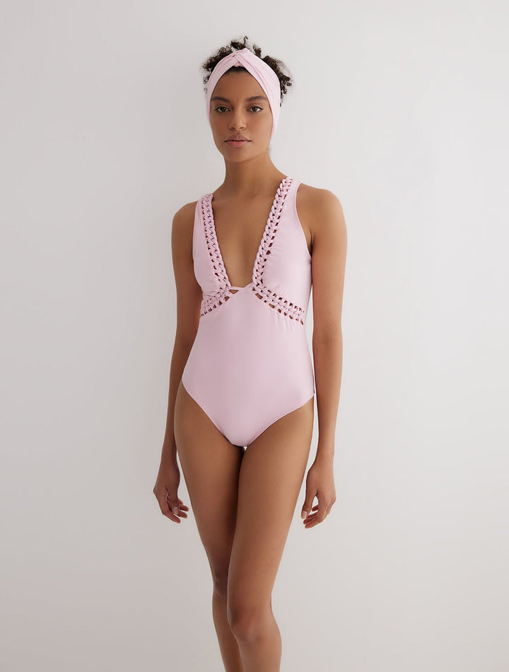 Front View: Model in Klara Pink Swimsuit - MOEVA Luxury Swimwear, Removable Paddings, Deep V Neckline, Chain Details Underbust, Chain Details on the V Neckline, Moderate Bottom Coverage, One Piece Soft Touch Fabric, MOEVA Luxury Swimwear