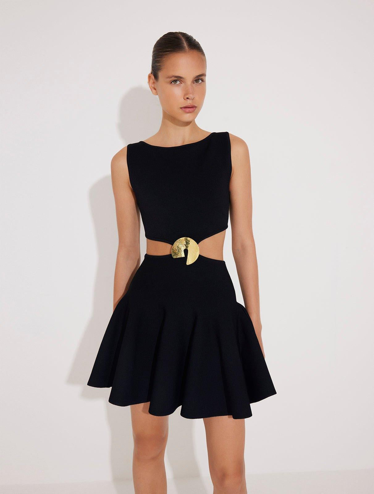 Lanao Black Cut-Out Knit Mini Dress with Gold Detail | Moeva | RTW Dresses | Each week unveils new pieces—luxury swimwear, fluid resort silhouettes, and elevated summer-to-evening essentials designed to carry you from coastal escapes to city nights.