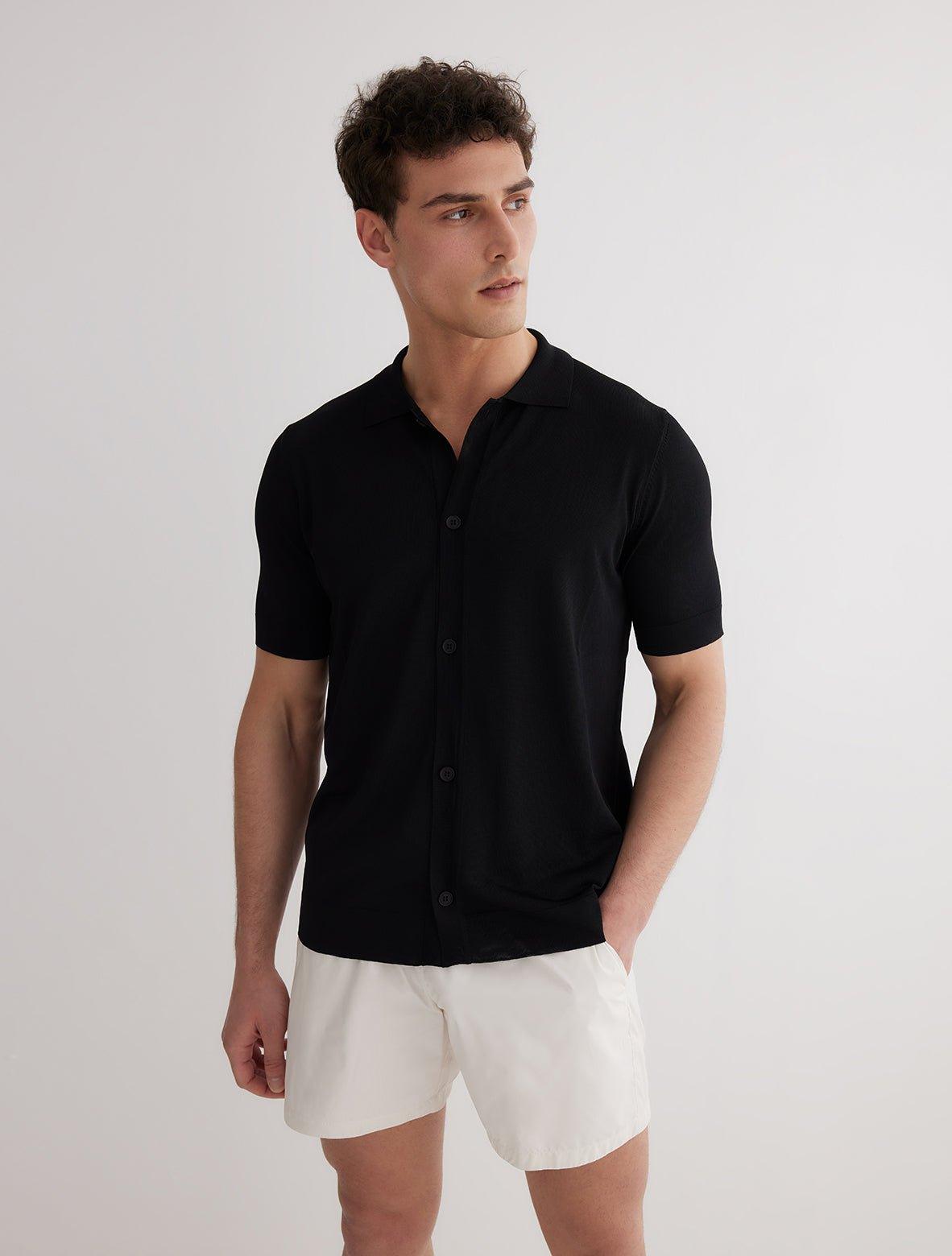 Lars Black Polo Shirt with Button Fastening | Moeva | Men Classic Collar Shirts | Each week unveils new pieces—luxury swimwear, fluid resort silhouettes, and elevated summer-to-evening essentials designed to carry you from coastal escapes to city nights.